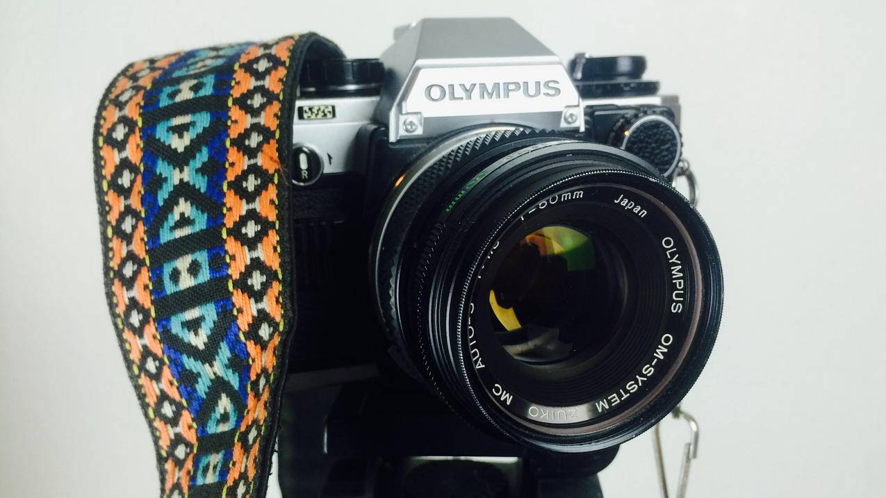 黑色和灰色奥林巴斯DSLR相机白色橙蓝色和White,Strap